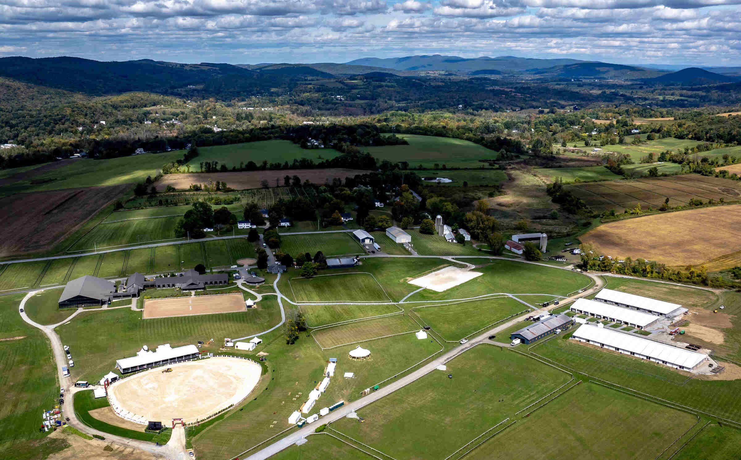 Aerial view of arenas, fields, and barns